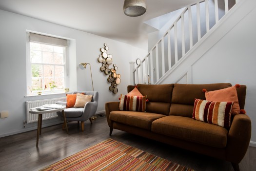 Cosy lounge with log burning fire in a holiday cottage