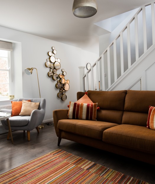 Cosy lounge with log burning fire in a holiday cottage