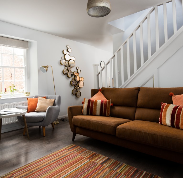 Cosy lounge with log burning fire in a holiday cottage