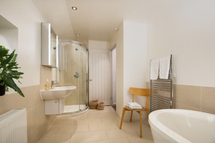large family bathroom with walk in shower and bath
