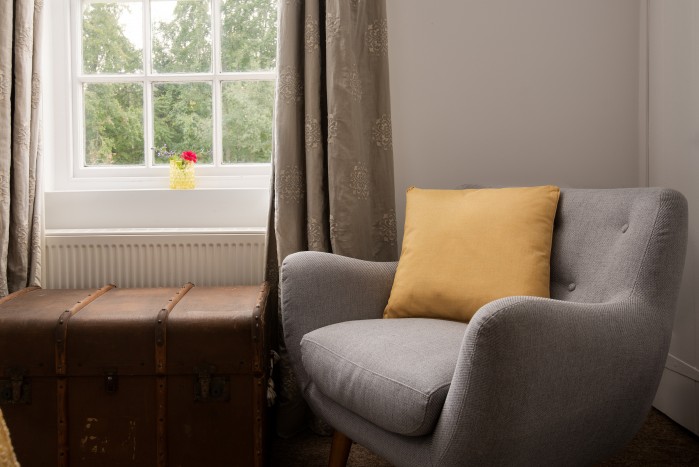 Cosy seat by window with countryside views of Northumberland