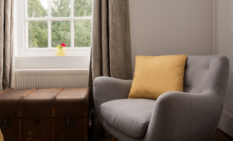 Cosy seat by window with countryside views of Northumberland