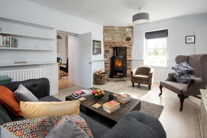 Cosy country cottage lounge with log burning fire