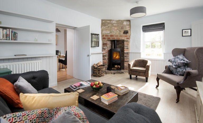 Cosy country cottage lounge with log burning fire