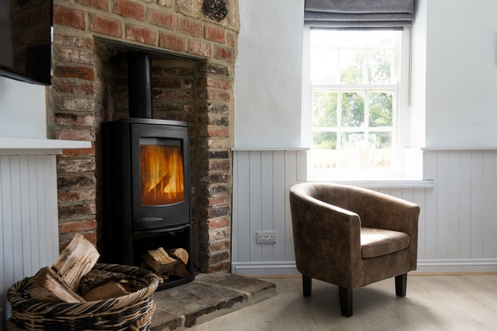 log burning fire in the lounge of Blakey house at Brinkburn