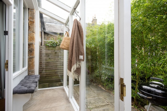 Entrance to Priory Cottage in English country garden
