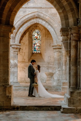 A couple kissing in Brinkburn Priory