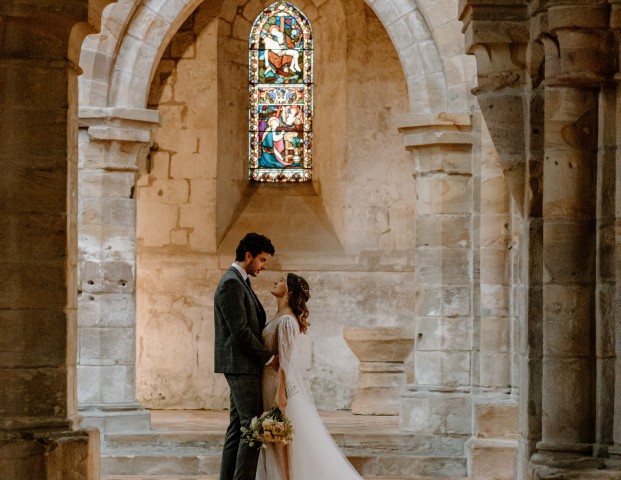 A couple kissing in Brinkburn Priory
