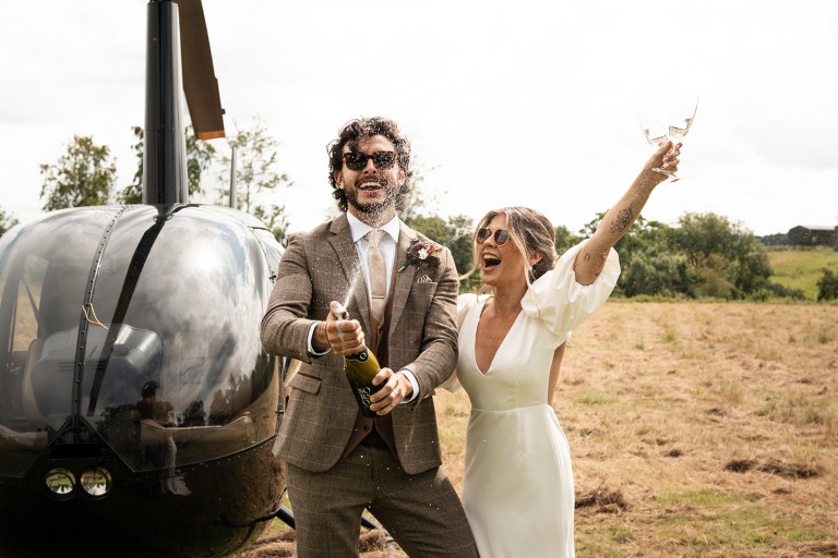 champagne spray helicopter wedding at Brinkburn Northumberland
