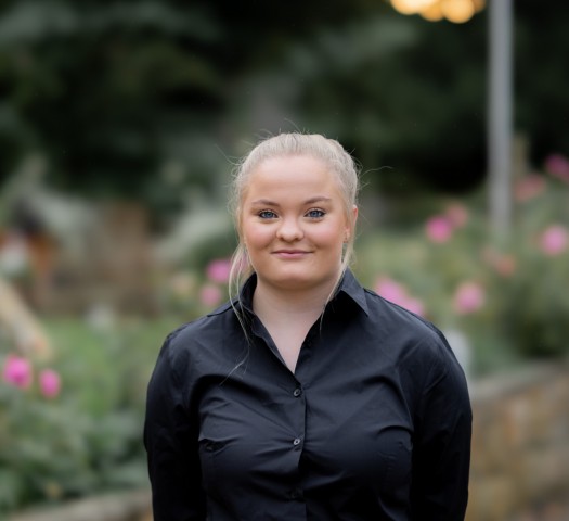 Portrait shot of Beth wearing a black shirt