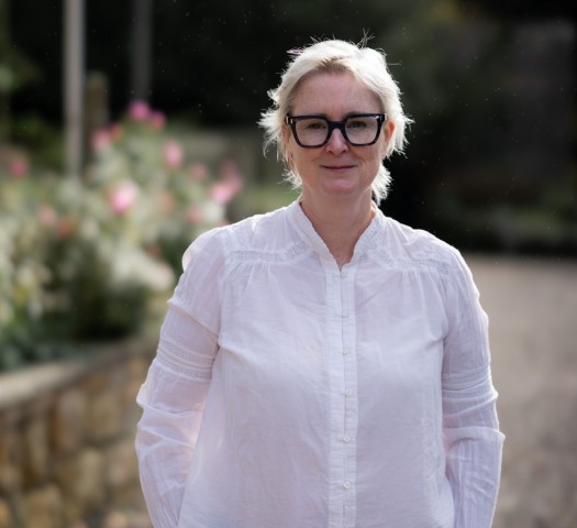 Portrait shot of Emma wearing a white shirt