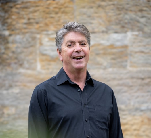 Portrait shot of Mark wearing a black shirt