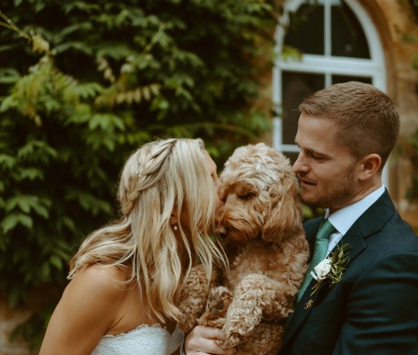 bride and groom with dog at Brinkburn Northumberland wedding