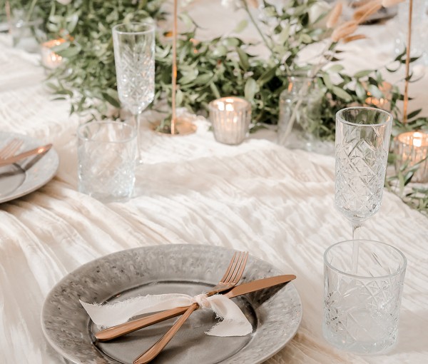 candlelit winter dining table in the garden room at brinkburn northumberland styled by bels flowers