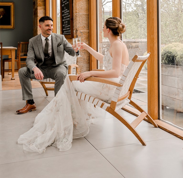 couple enjoying a garden room wedding at Brinkburn Northumberland captured by Helen Russell photography