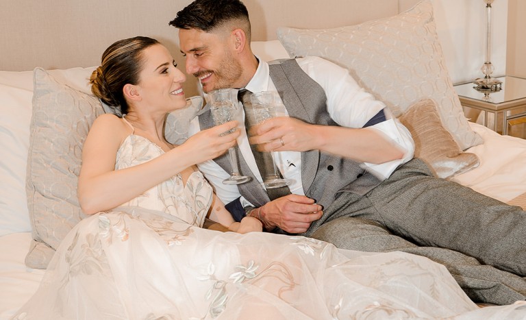 couple in the bridal suite at Brinkburn Northumberland after an intimate wedding in the garden room