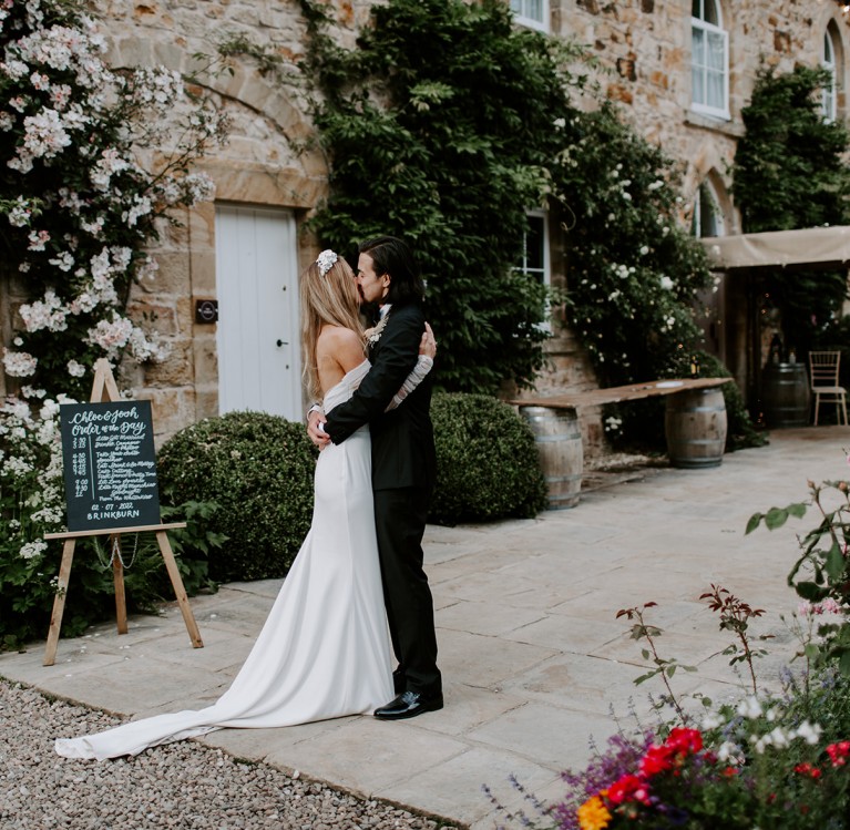 A couple outside the stables at Brinkburn Northumberland wedding