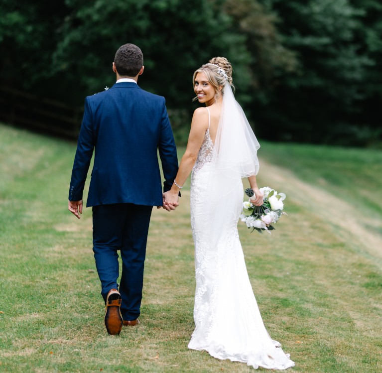 A couple outside the priory and Manor House at Brinkburn Northumberland
