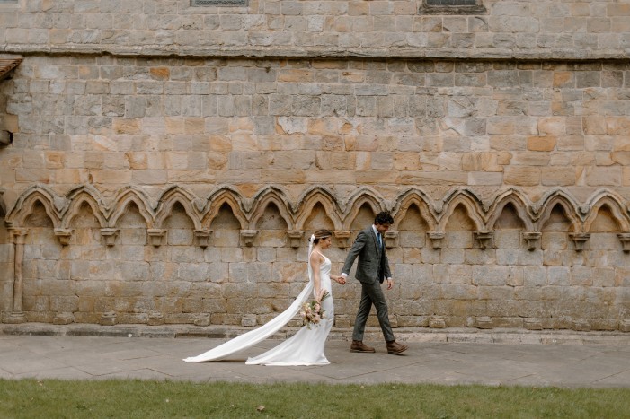 couple walking outside brinkburn priory