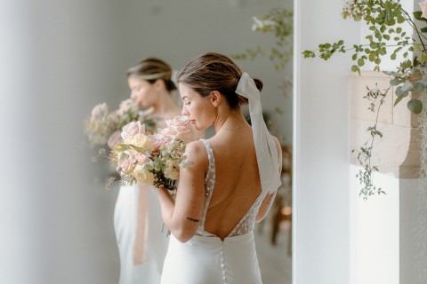 Bridal wedding photoshoot with flowers and wedding dress in the Brinkburn White Room