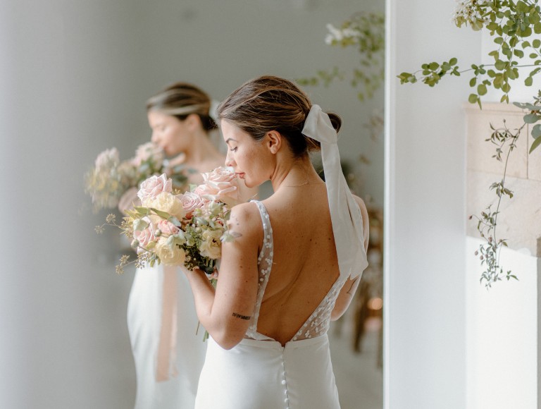 Bridal wedding photoshoot with flowers and wedding dress in the Brinkburn White Room