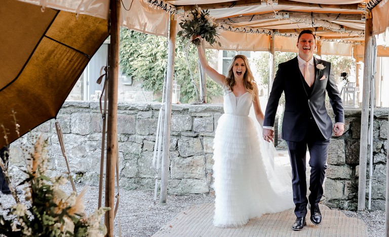 Couple entering the tipi at Brinkburn Northumberland