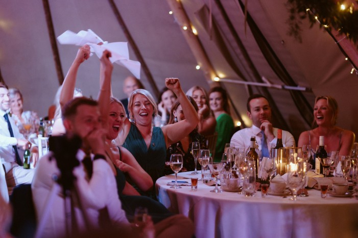 Wedding guests during speeches at Brinkburn Northumberland
