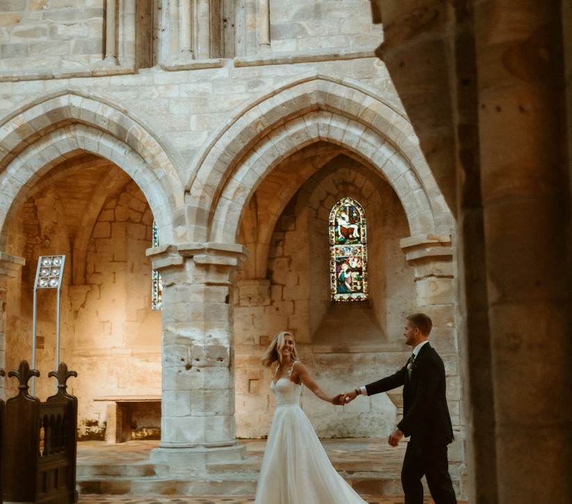bride and groom getting married in the priory at Brinkburn Northumberland