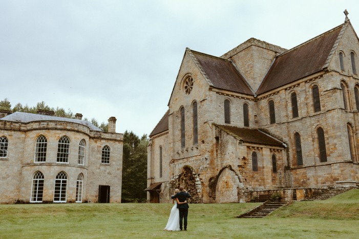 bride and groom outside the priory and Manor House at Brinkburn Northumberland wedding