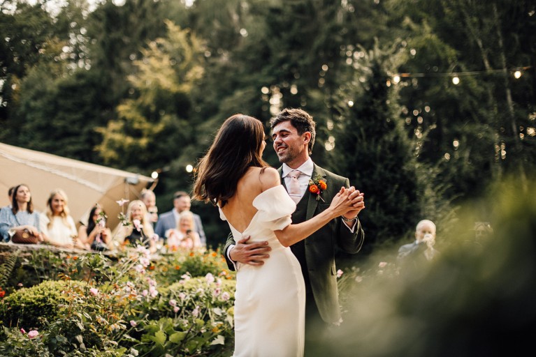 Bride and groom dancing outside Brinkburn Northumberland